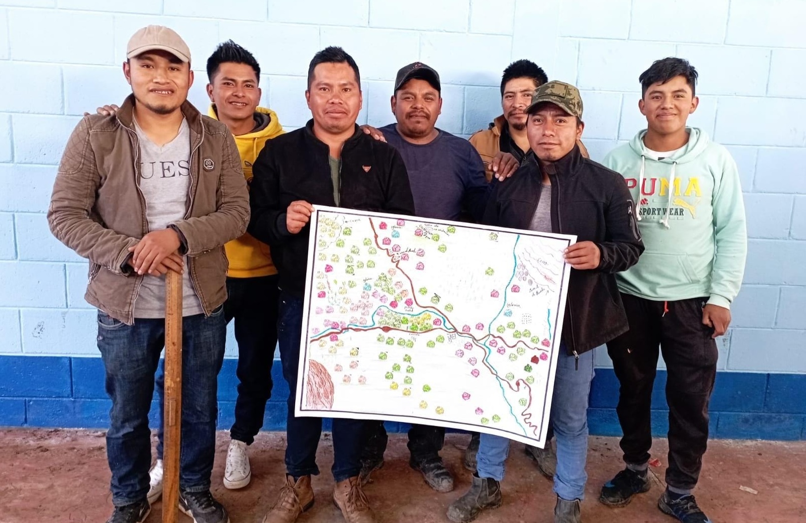 Group of people holding a disaster preparedness map.