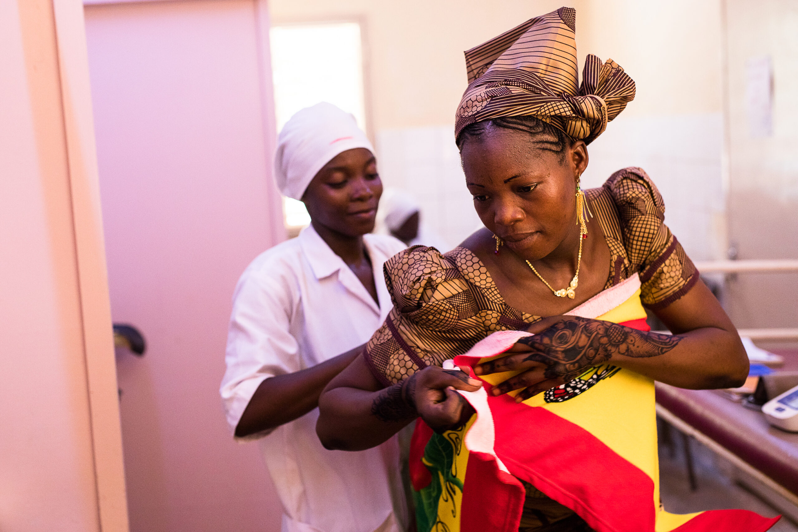Scenes of FP counseling sessions and and an implant insertion at the CSPS Dassasgho in Ouagadougou