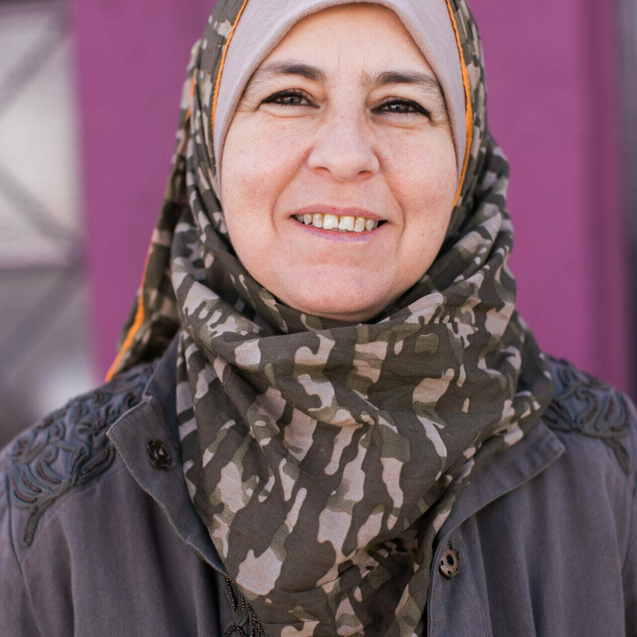Frontal headshot of Arwa Alkhwaja smiling