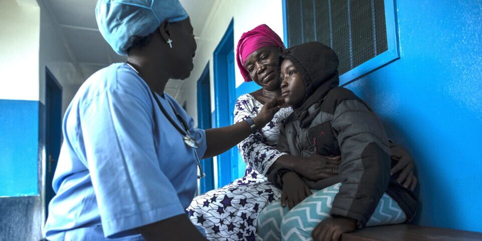 BREWERVILLE, LIBERIA: Aug. 22, 2017 - Wislyne S. Yarh Sieh is a registered nurse and Officer in Charge (OIC) at Kpallah Community Clinic in Brewerville. Wisylne worked as a healthcare worker during the Ebola outbreak in 2014-2015. Healthcare workers like Wislyne were left isolated and alone to fight this mysterious disease from the heart of the jungle. But, she, along with many others, continued to fight. "Being a nurse is like being a soldier. You cannot take your uniform off when there is battle. Then you are not a soldier. So I went on the frontline because I wanted to save lives," she remembers. 
The Ministry of Health did not have a centralized system to communicate vital information to healthcare workers across the country at the same time. UNICEF and USAID worked together to create a platform that utilized mobile phones to facilitate a two way communications system between healthcare workers and the centralized ministry. 
Because of this new technology, healthcare workers across the country can receive text messages with important information about health emergencies. They are also able to use their phones to inform the Ministry of Health about the status of stocks in the clinic. 
Since Ebola, Wislyne has started using the new platform and now feels more connected and informed. She says, "If this program just stopped without things being in place, it would carry our work backward. It would make my work longer and delay treatment of the patients." Photo by Sarah Grile. 

.